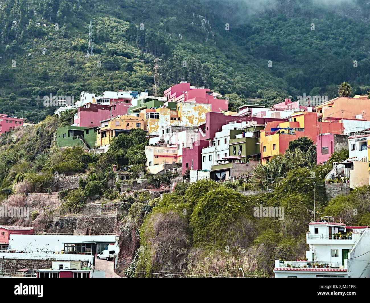 Cube houses, like colorful garages stacked in the mountainside. The Canarian construction and life is colorful among green hillsides in the north of t Stock Photo