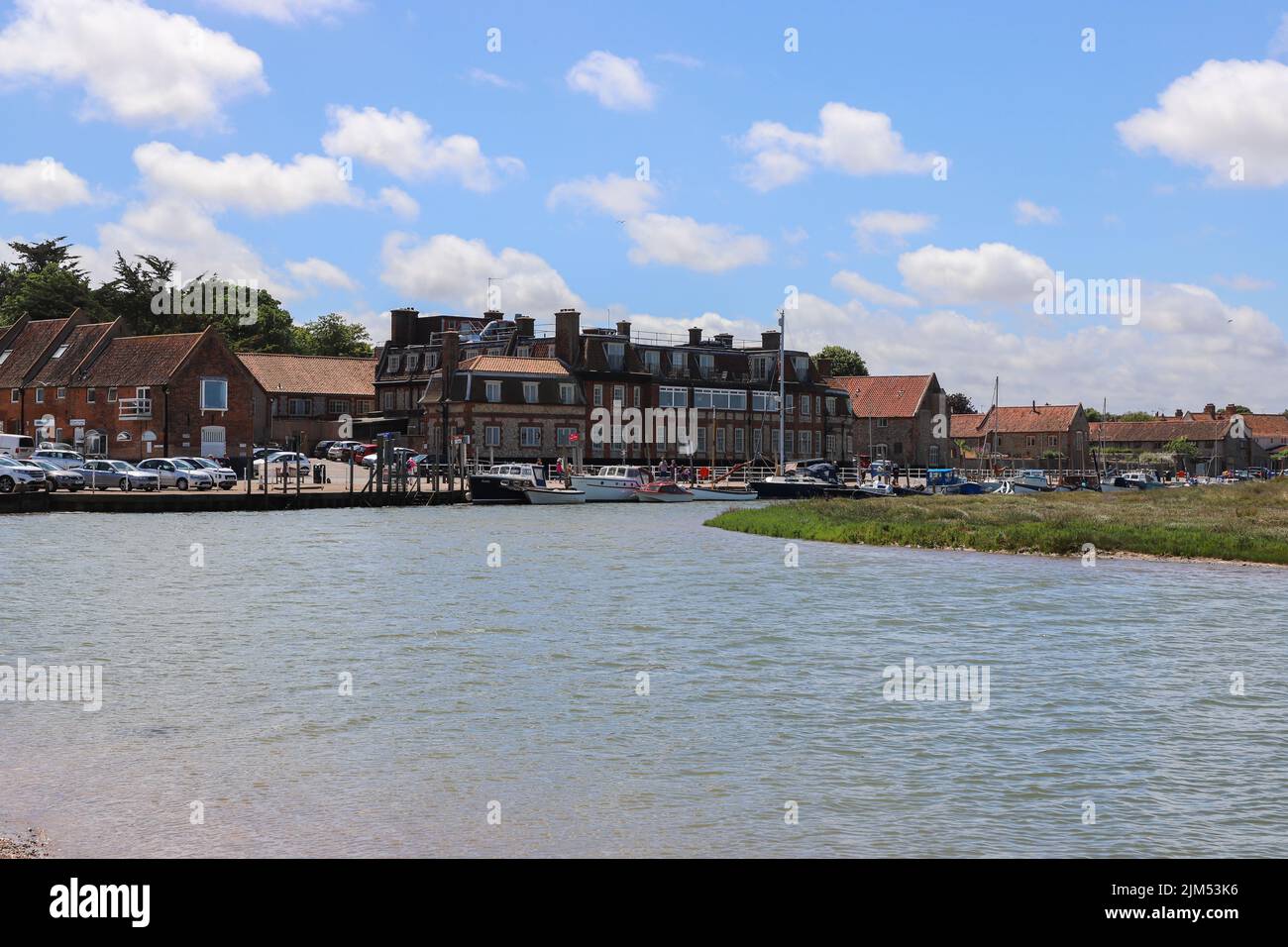 A waterfront view of buuildings in Blakeney in North Norfolk and the River Glaven Stock Photo