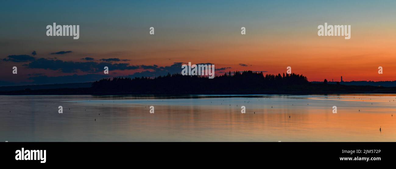 July 29, 2022.  Barnes Island.  Sunset view of Whaleboat Island.  Casco Bay, Maine Stock Photo