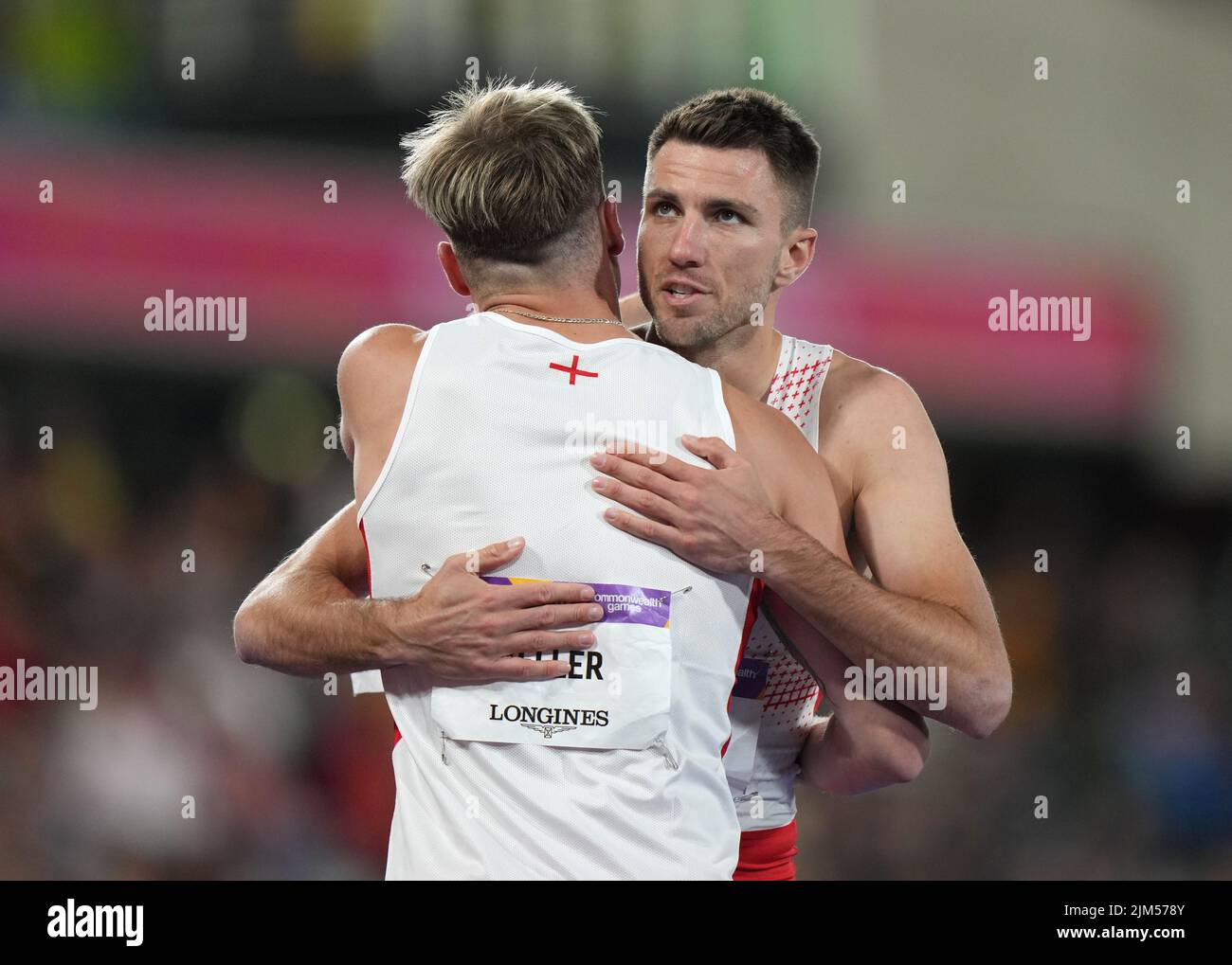 England's Andrew Pozzi (right) who won bronze is embraced by compatriot Joshua Zeller, who finished fourth after the Men's 110m Hurdles Final at Alexander Stadium on day seven of the 2022 Commonwealth Games in Birmingham. Picture date: Thursday August 4, 2022. Stock Photo