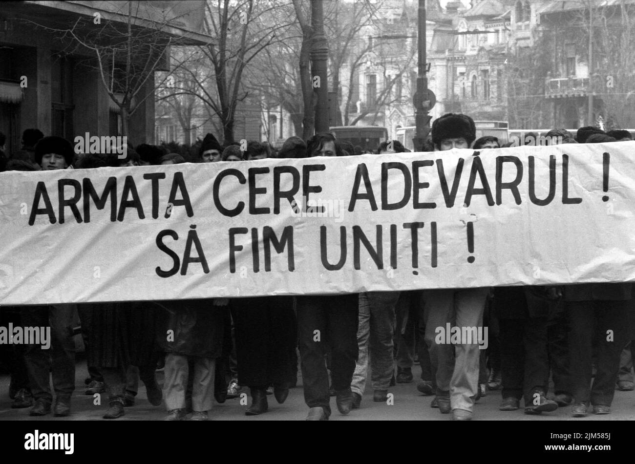Bucharest, Romania, January 1990. Rally in the University Square following the Romanian Revolution of 1989. People would gather daily to protest the ex-communist officials that grabbed the power after the Revolution. The banner says 'The army asks for the truth. Stay united.' Stock Photo