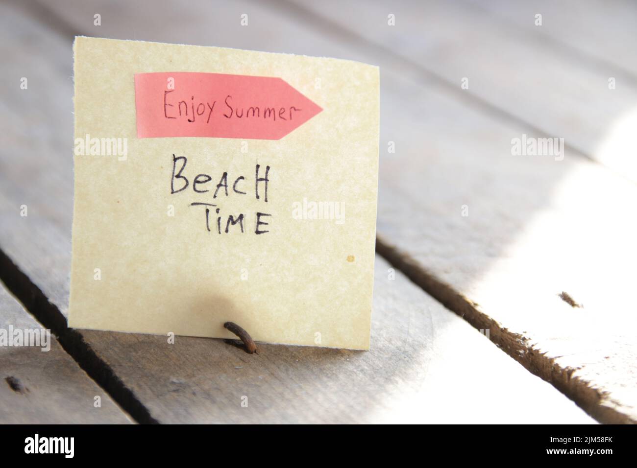 Sign with the inscription beach time. Summer travel idea. Stock Photo