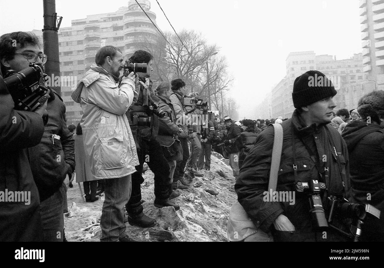 Bucharest, Romania, January 1990. Press photographers covering the rallies in the University Square following the Romanian Revolution of 1989. People would gather daily to protest the ex-communist officials that grabbed the power after the Revolution. Stock Photo