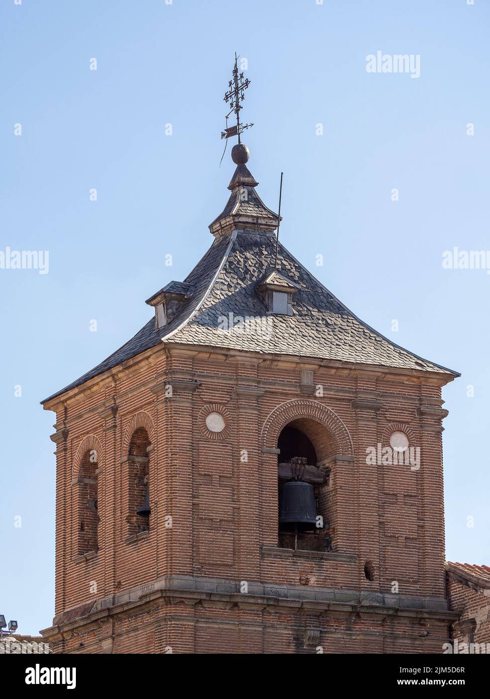 A vertical shot of the bell tower of the Church of Saint John Baptist ...