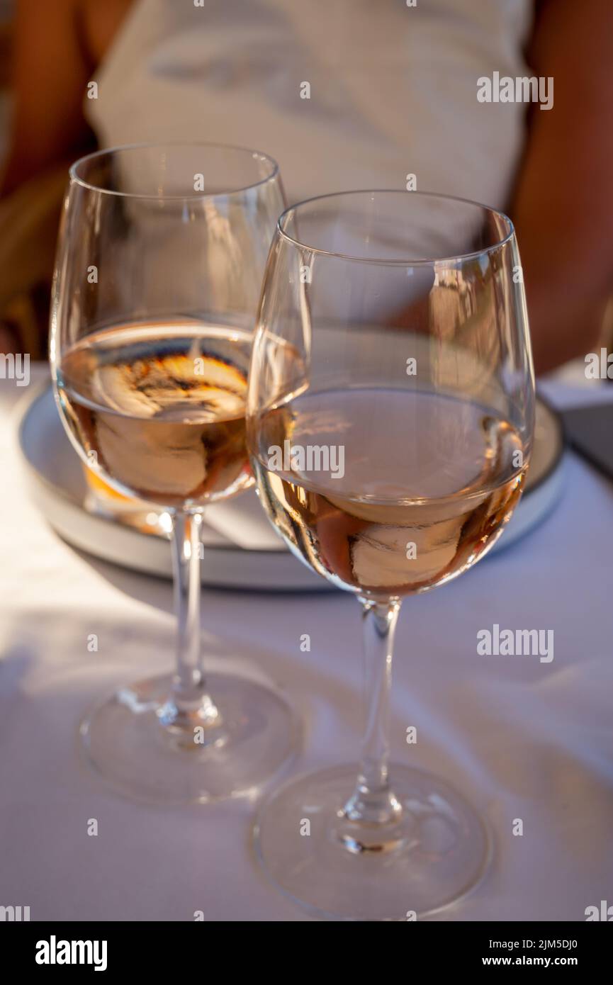 Dinner at sunset in French gourmet restaurant with cold dry rose wine