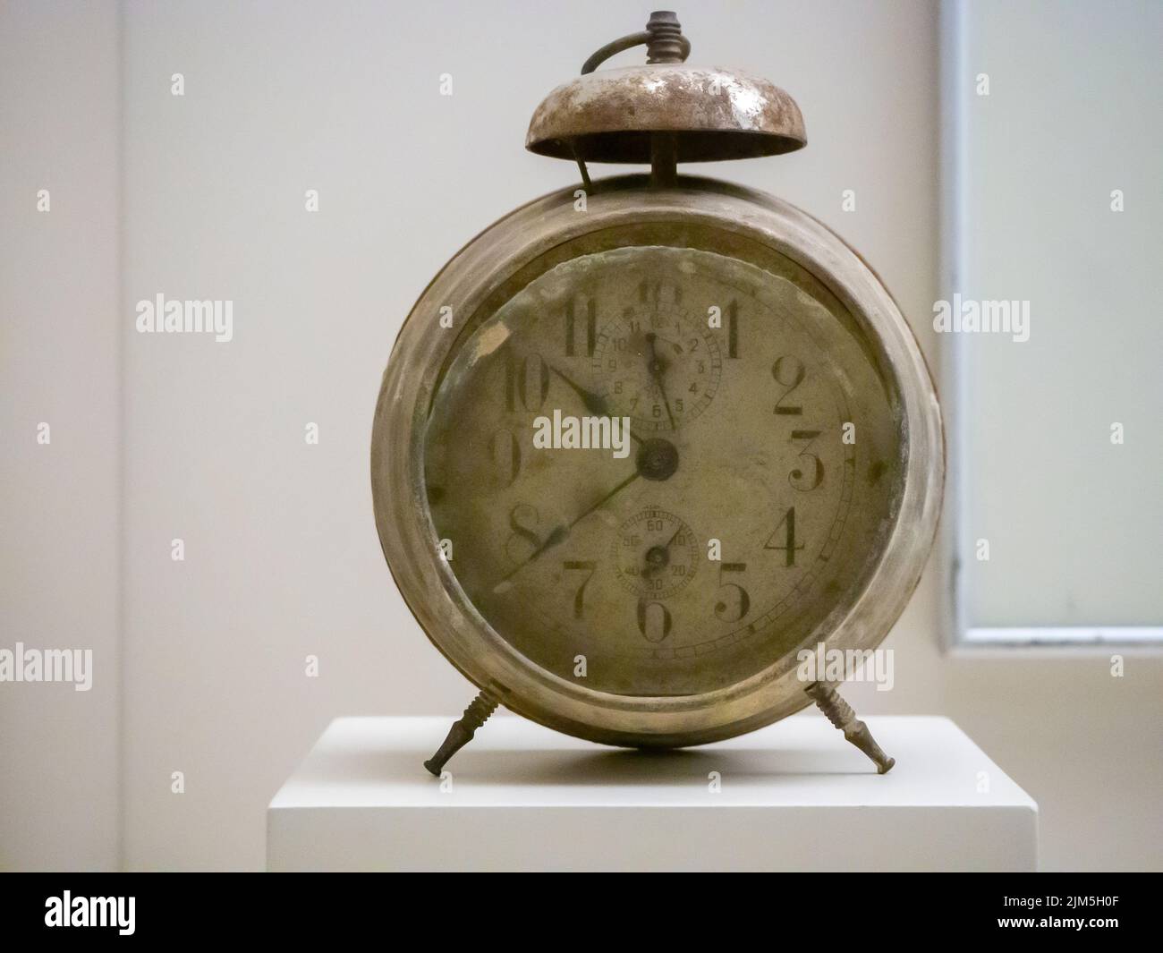 An ancient alarm clock on a display in a museum Stock Photo Alamy