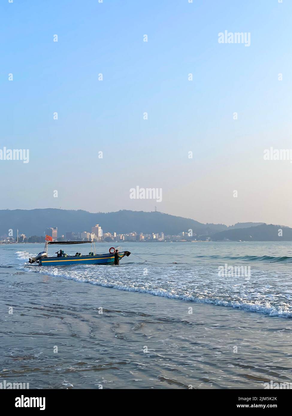 A boat on the beach on the sunset Stock Photo - Alamy