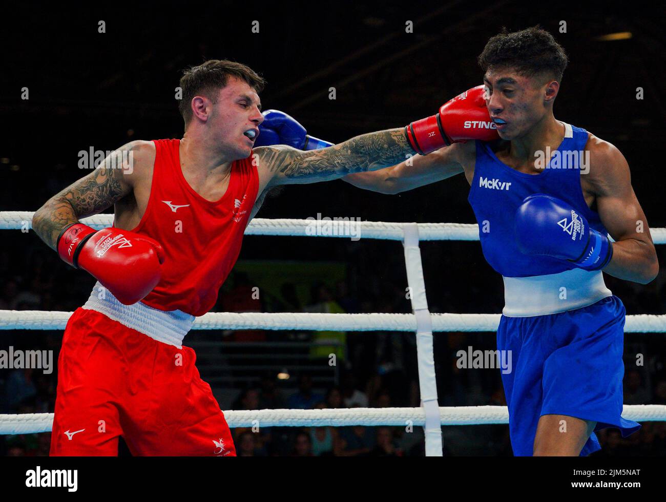 Wales's Jamie Dodd (Red) and Northern Ireland's Clepson Antonio Dos Santos Paiva (Blue) in the Men's Fly (48-51kg) at The NEC on day seven of the 2022 Commonwealth Games in Birmingham. Picture date: Thursday August 4, 2022. Stock Photo