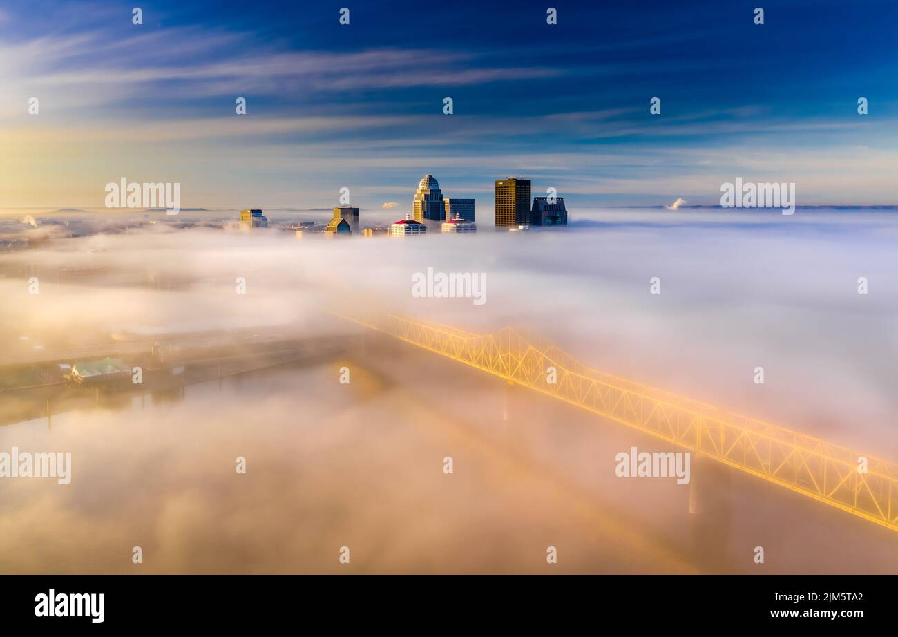 An aerial view of a modern city in fog on the sunrise Stock Photo - Alamy