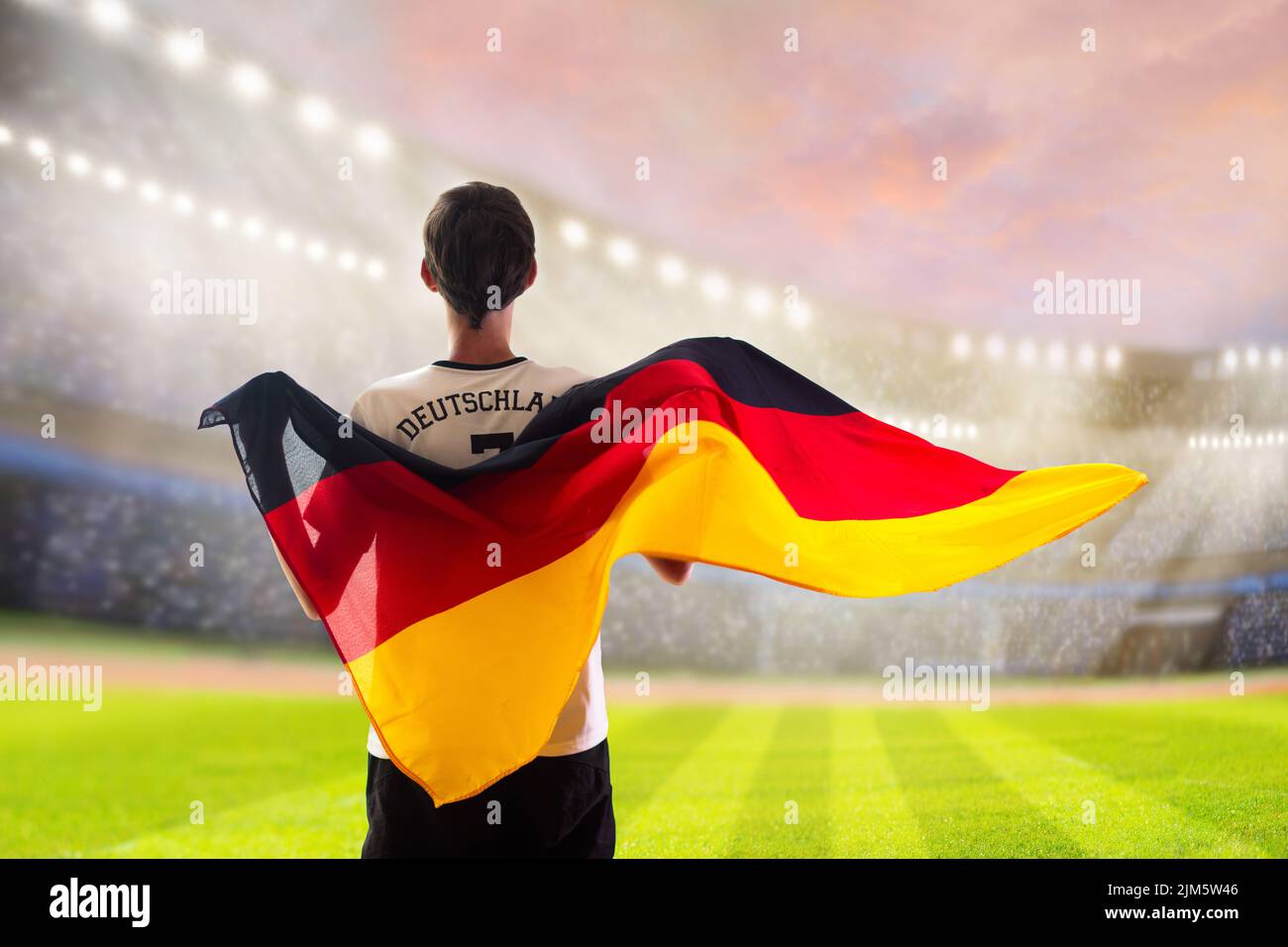Germany football supporter on stadium. German fans on soccer pitch