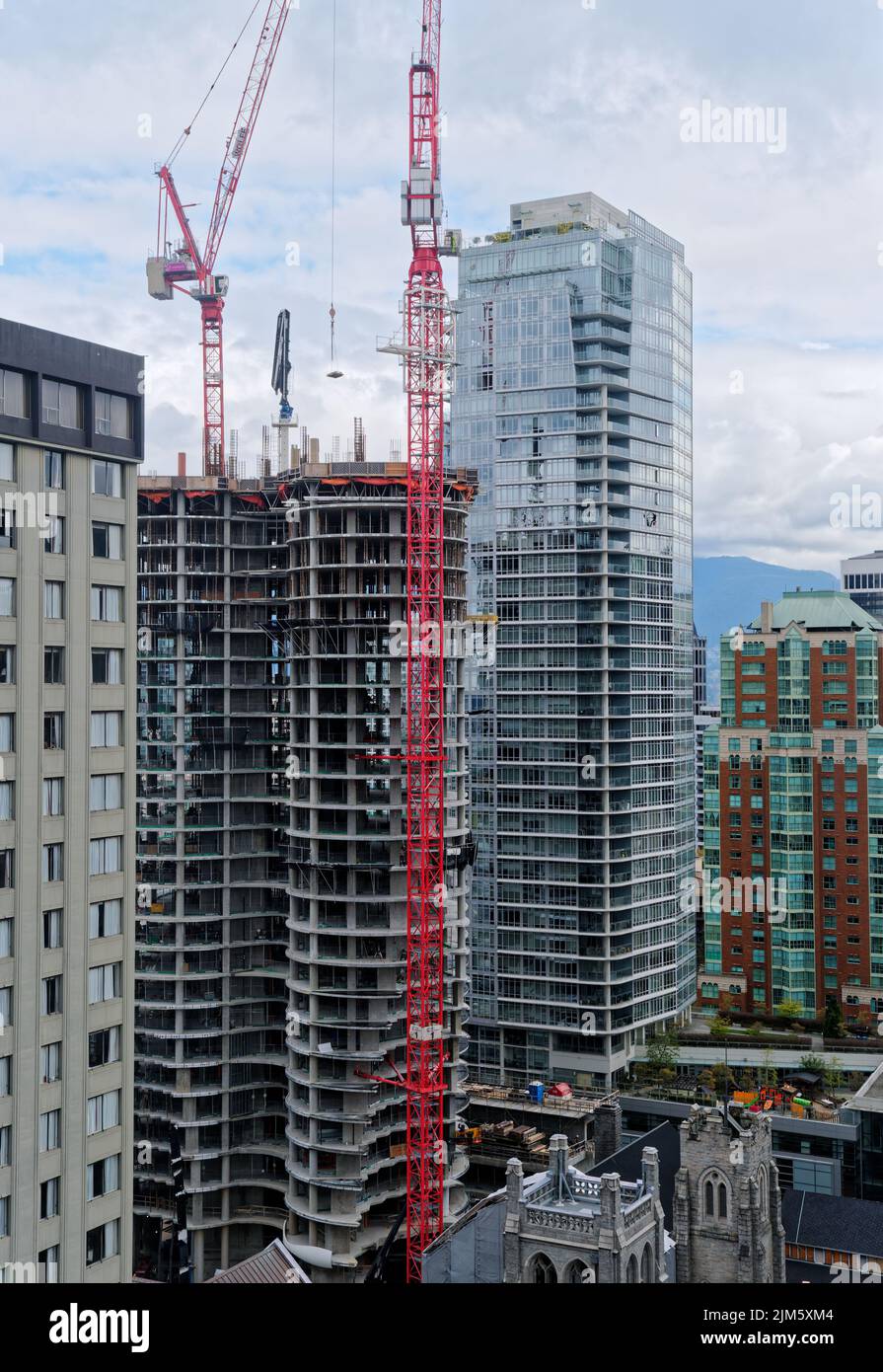 Red Construction Crane on Vancouver High Rise Stock Photo