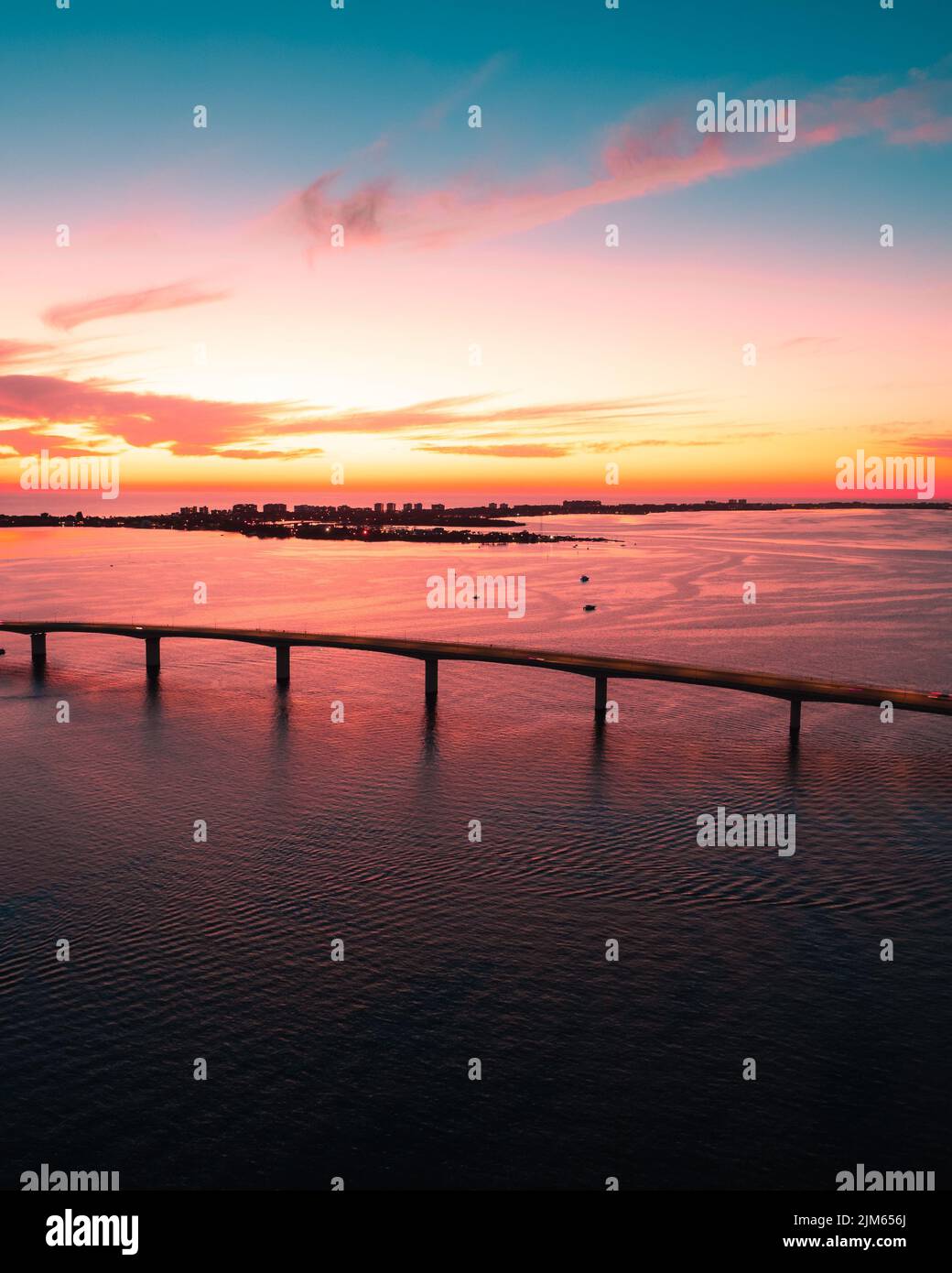A beautiful colorful sunset and a sky reflection on the sea Stock Photo ...
