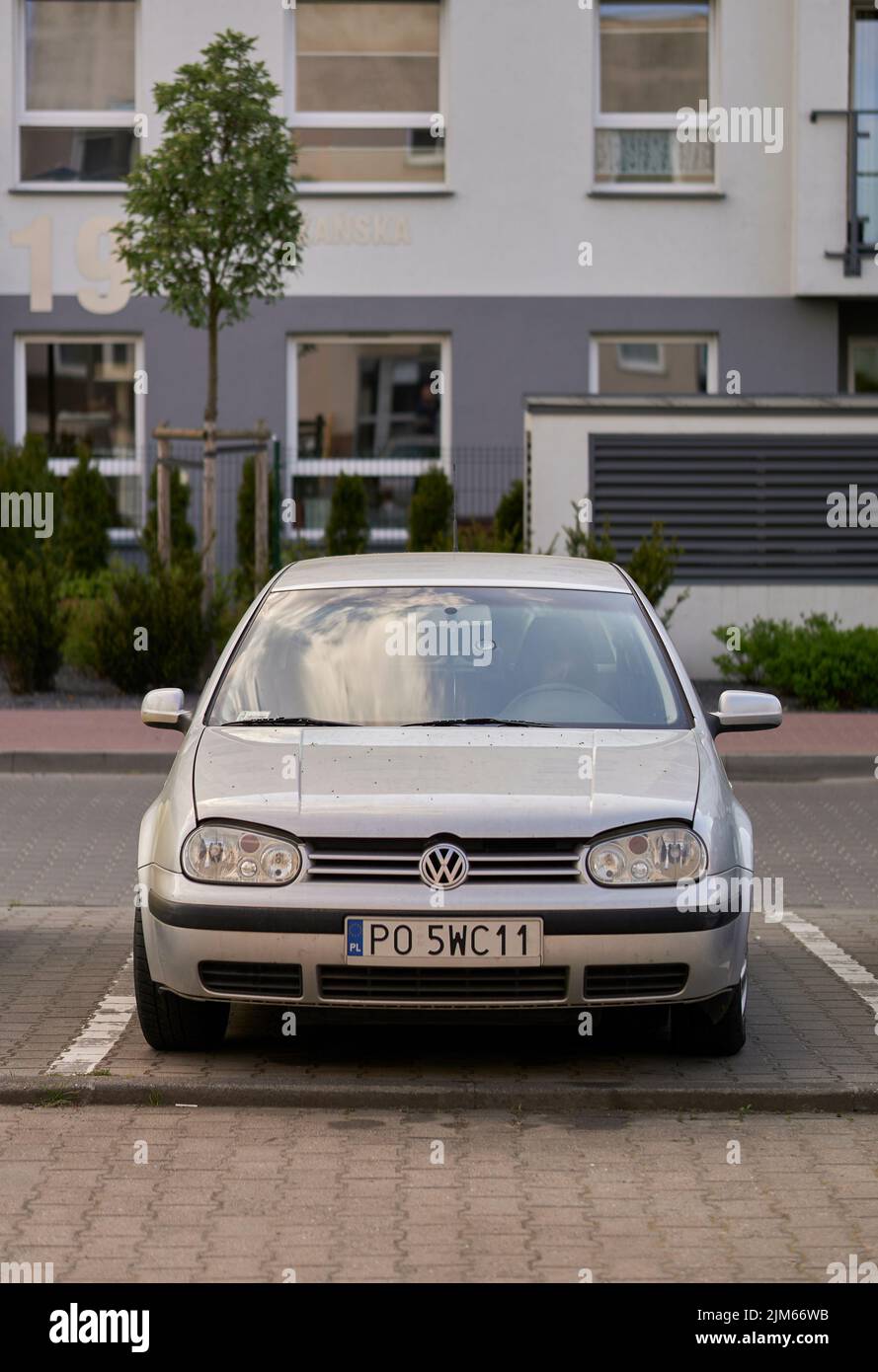 The front of a parked Volkswagen Golf car in a parking lot in the Stare Zegrze district. Poznan. Stock Photo