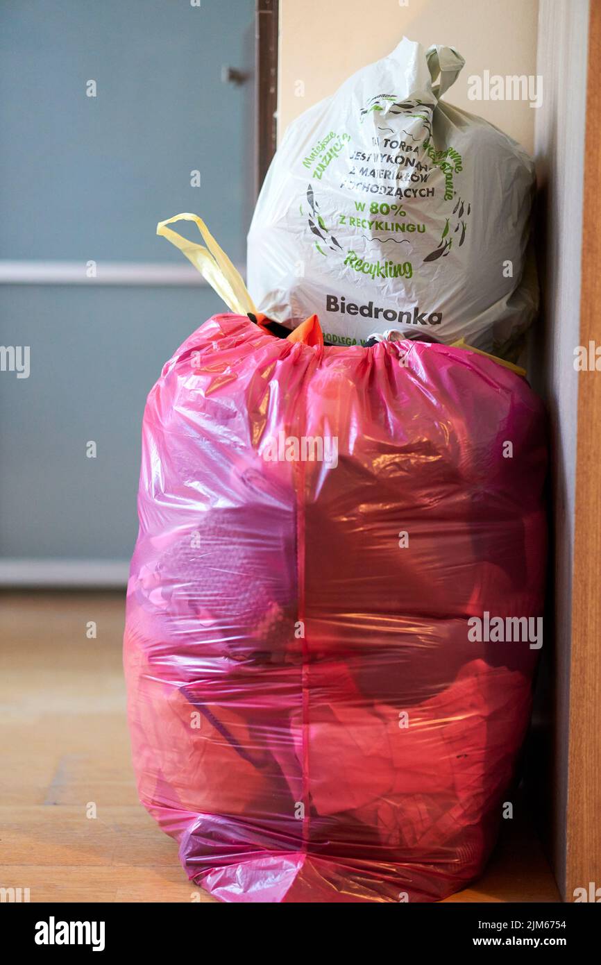 https://c8.alamy.com/comp/2JM6754/a-vertical-closeup-of-two-plastic-bags-with-clothes-and-garbage-stacked-on-top-of-each-other-2JM6754.jpg