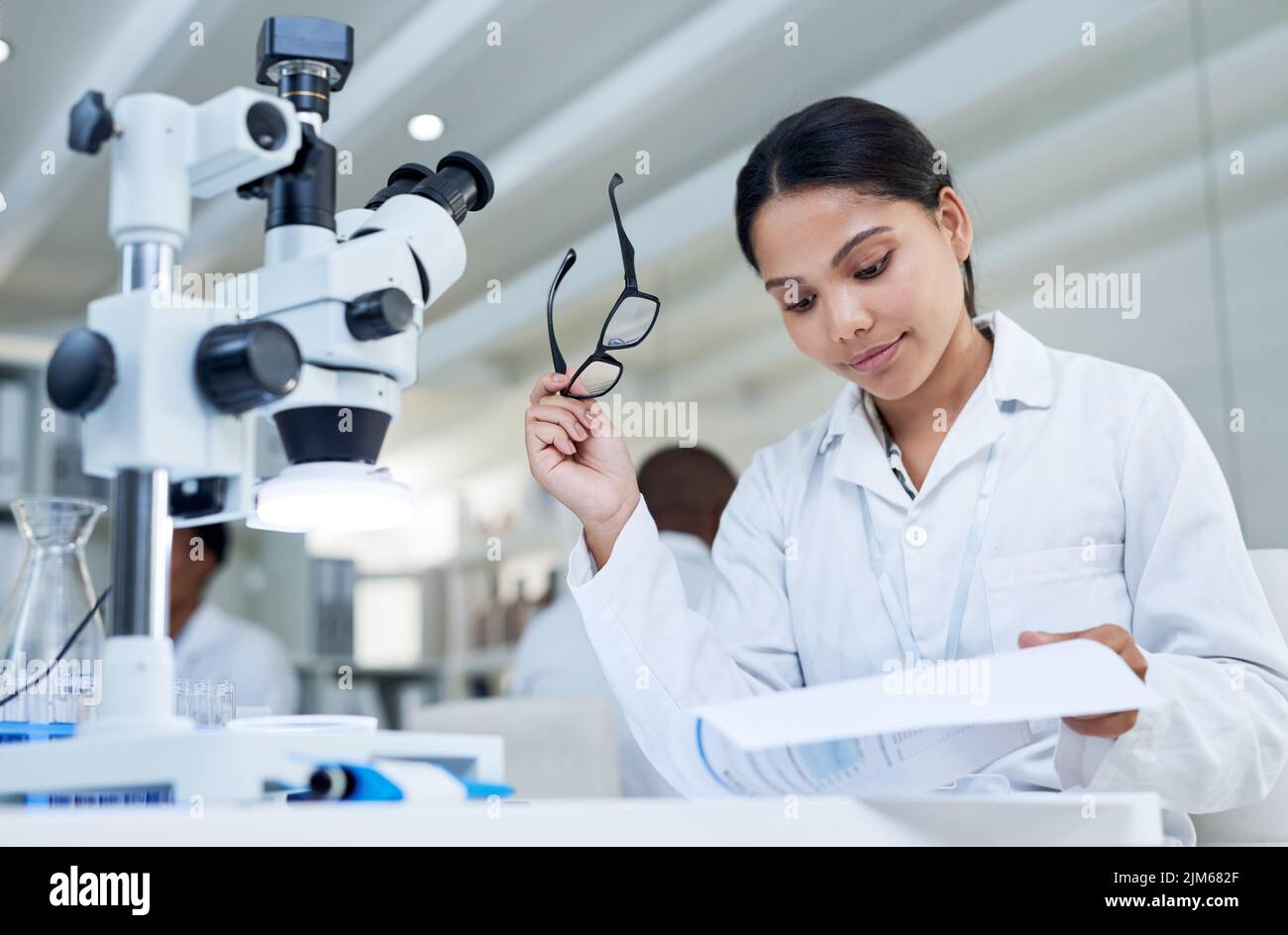 Conducting some labbased research. a young scientist going through