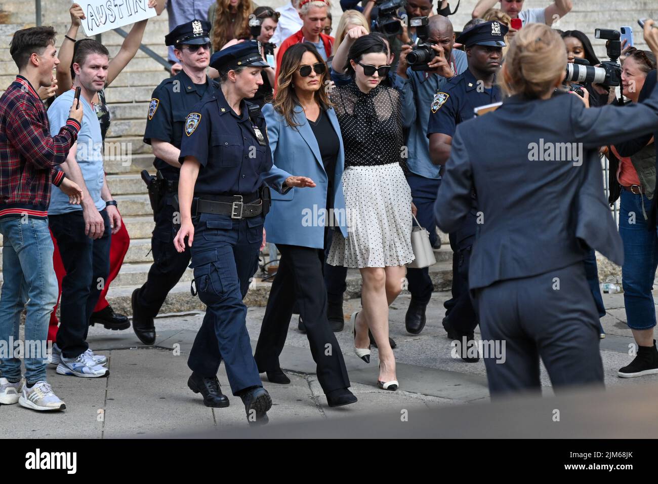 Mariska Hargitay (blue jacket) on the set of 'Law and Order: Special Victims Unit' filming outside the New York State Supreme Court Building on August Stock Photo
