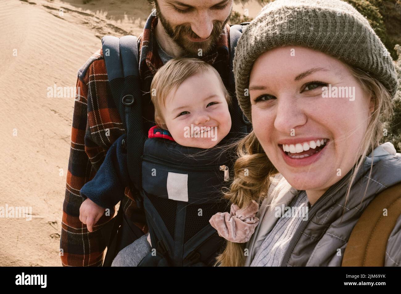 A cute selfie of an American family with a little girl in a baby carrier Stock Photo Alamy
