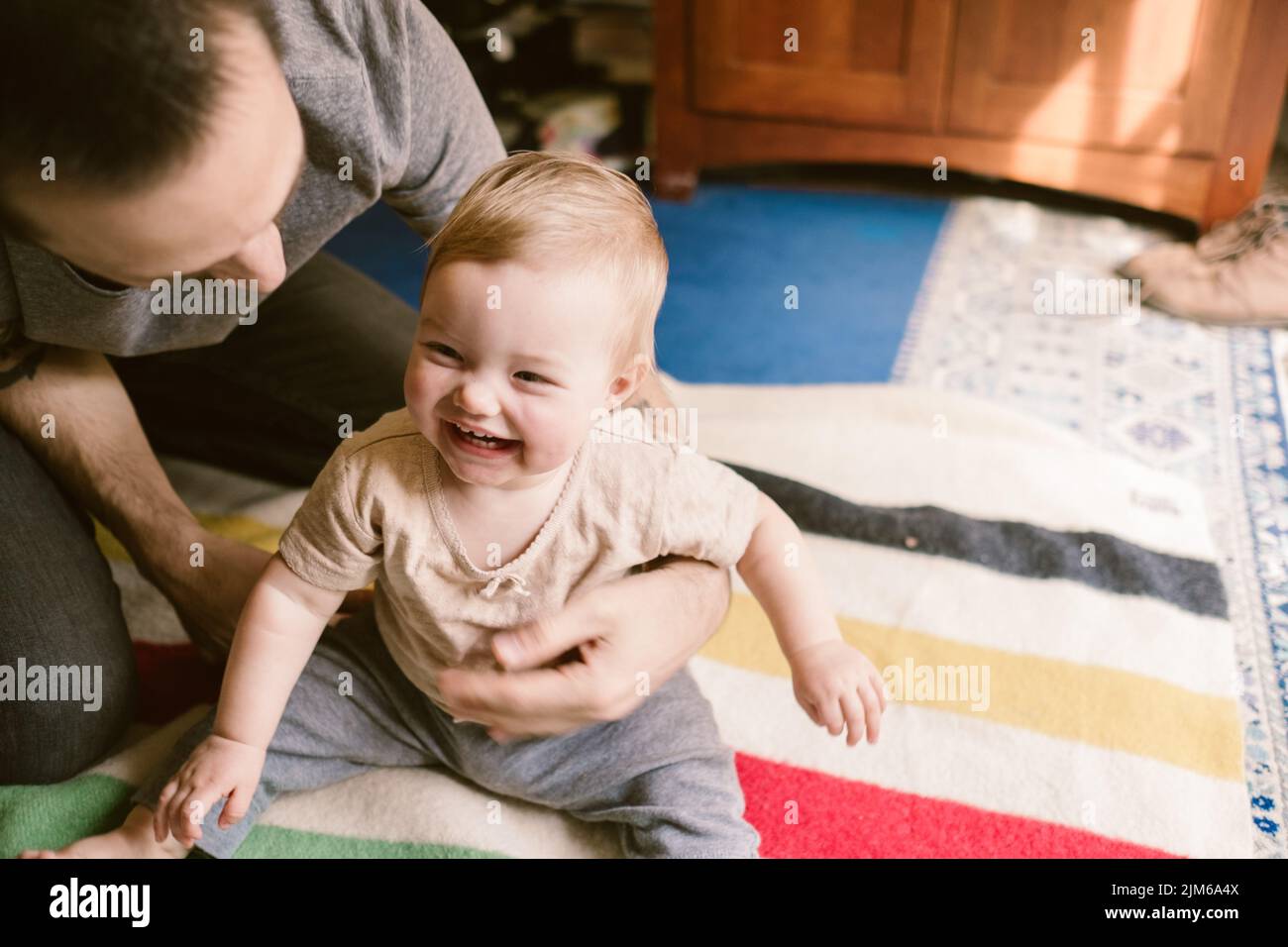 The father and daughter playing together at home Stock Photo - Alamy