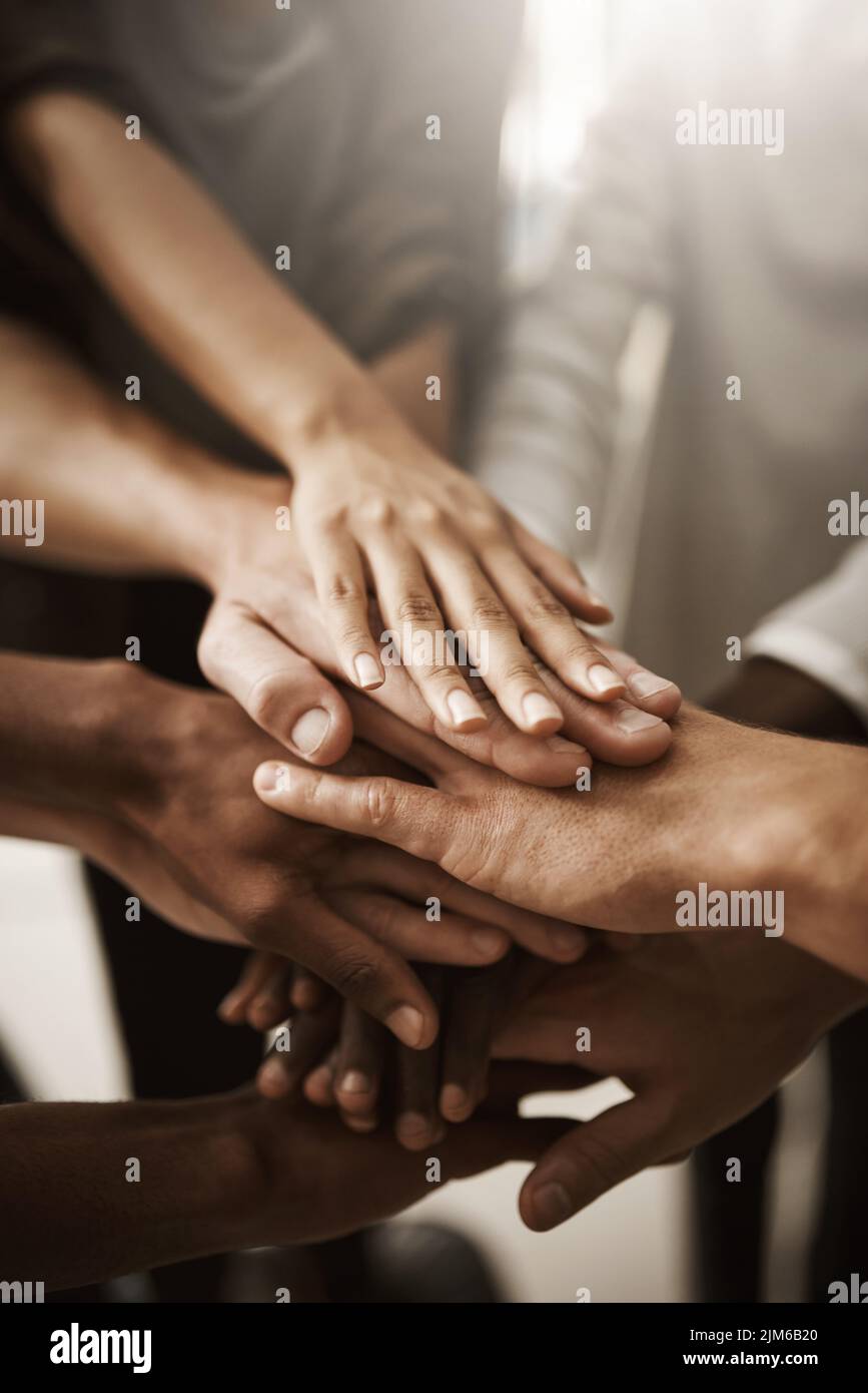 Hands of group of corporate business people stacked for teamwork, collaboration and celebration. Team of workers, employees and coworkers showing Stock Photo