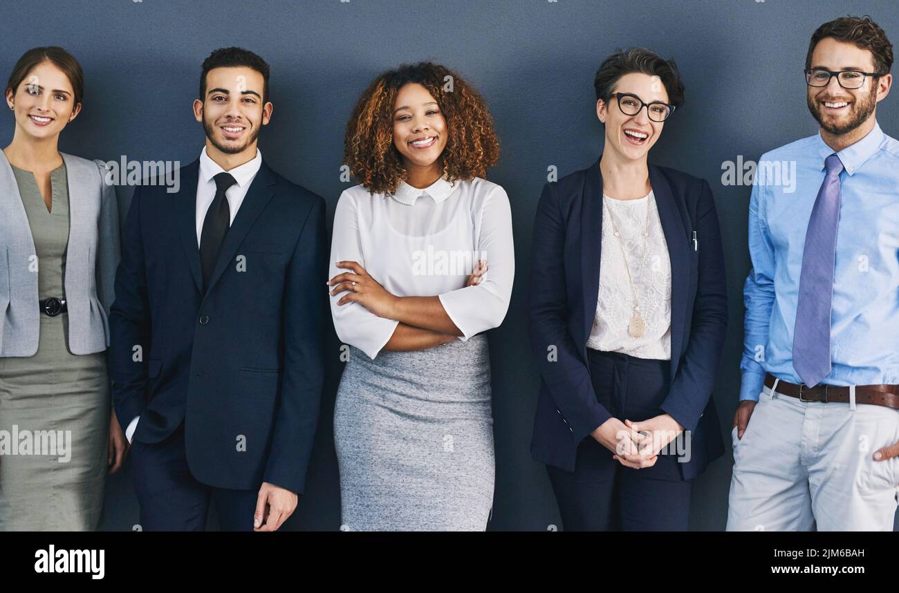 Teamwork, success and confident pose of business office worker team posing together and smiling. Happy corporate work professional group posing Stock Photo