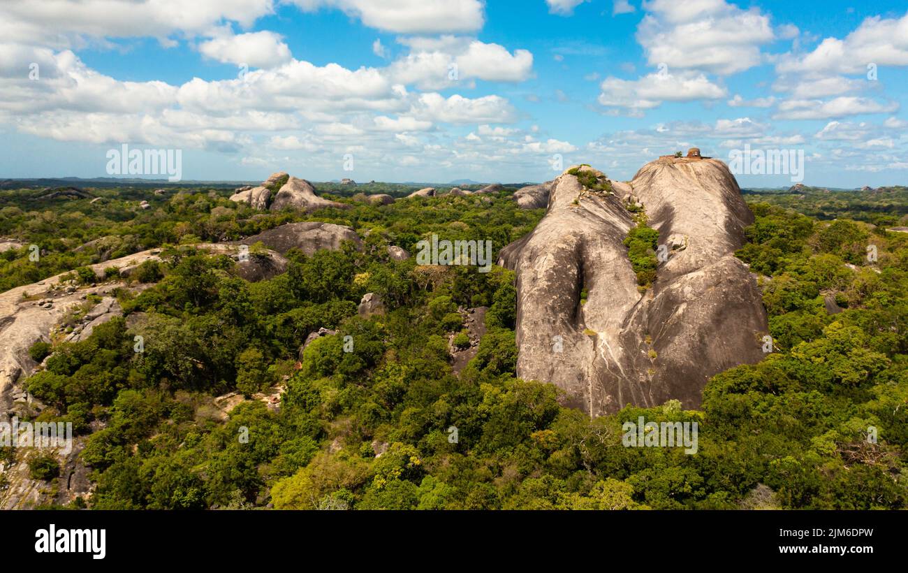 Dpw Rocks Rocks among the rainforest and jungle against the blue sky and clouds ...