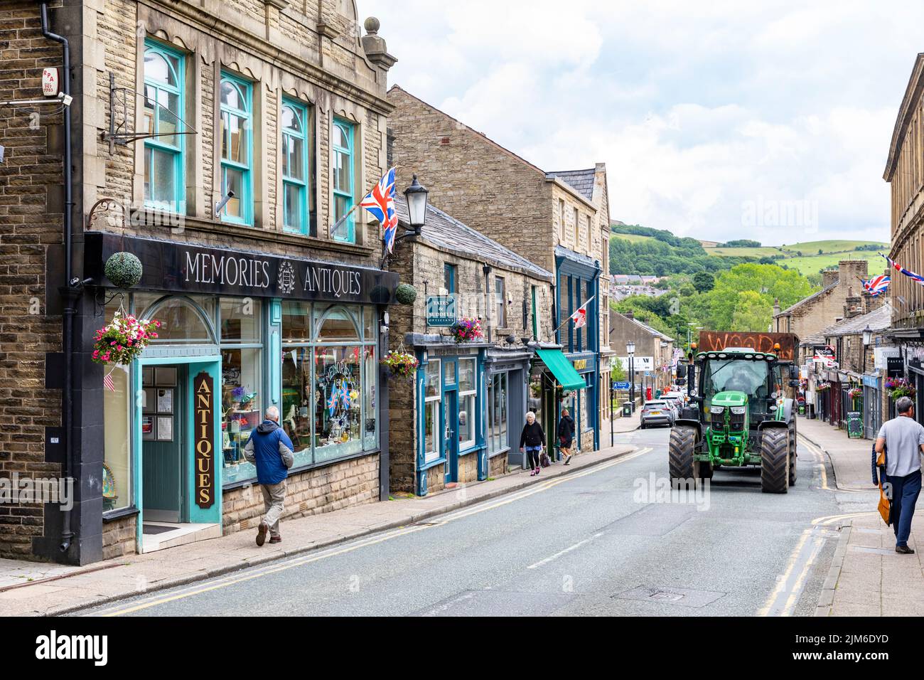 Ramsbottom Village in Bury, Manchester, view of shops and business on Bridge street with tractor on the road,Lancashire,England,summer 2022 Stock Photo