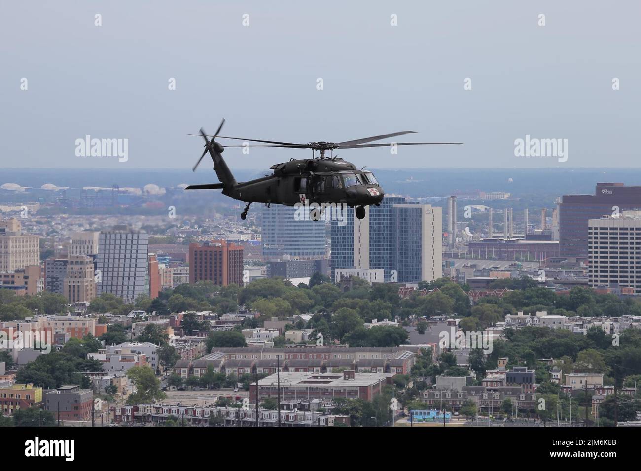 A UH-60 Black Hawk helicopter from the Pennsylvania National Guard’s 28th Expeditionary Combat Aviation Brigade flies over Philadelphia during a recent Dense Urban Terrain exercise. The exercise, which ran from July 25 to 29, was conducted by Task Force 46, a 600-personnel chemical, biological, radiological or nuclear (CBRN) response element, comprised of National Guard units from states across the country. (U.S. Army photo by Sgt. Eric Smith) Stock Photo