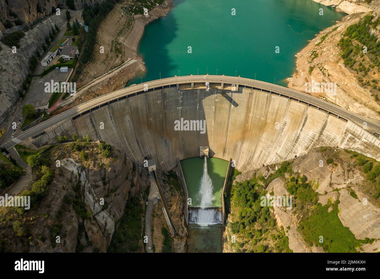Aerial view of La Llosa del Cavall reservoir dam with little water during summer drought of 2022 (Vall de Lord, Solsonès, Lleida, Catalonia, Spain) Stock Photo