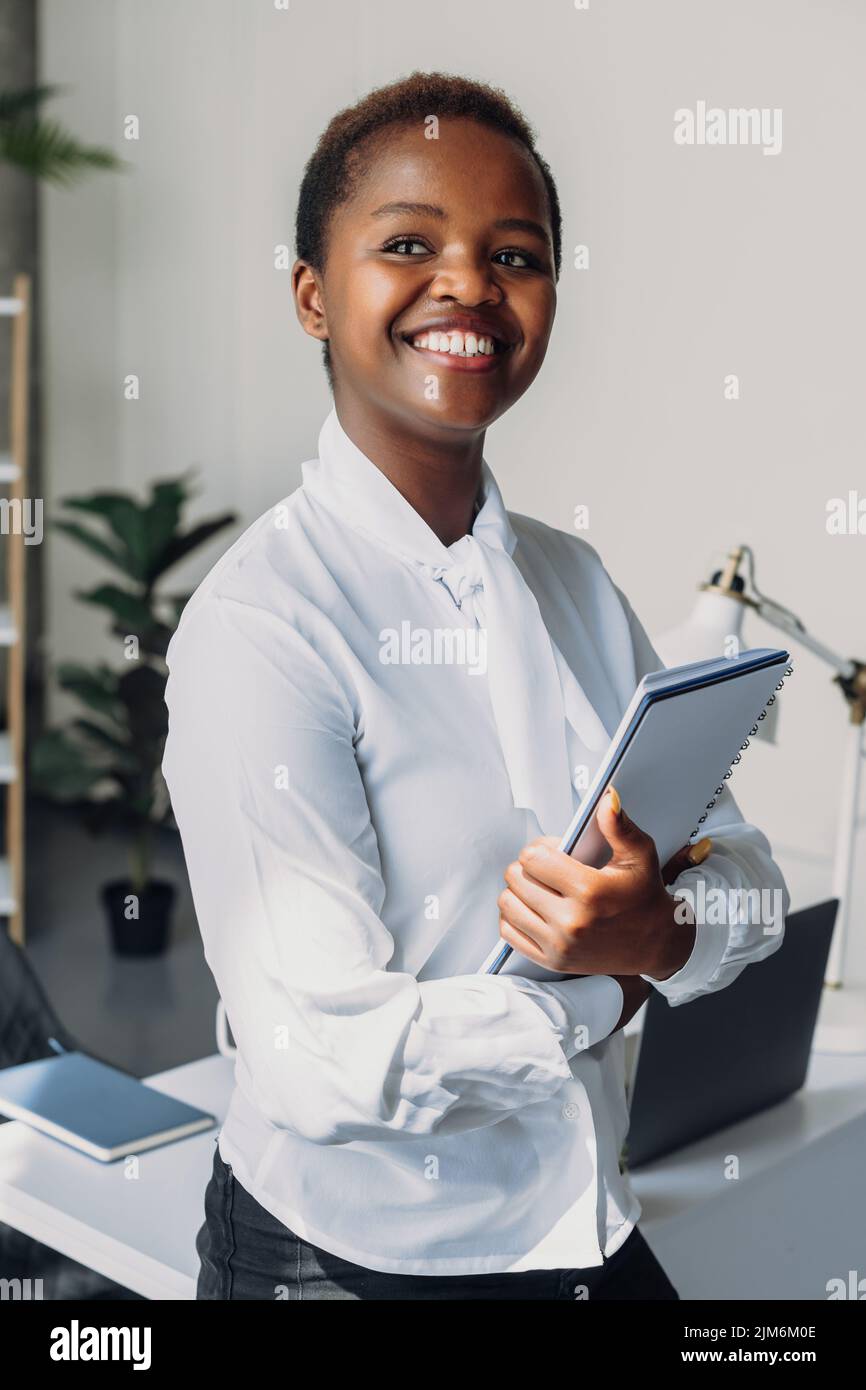 Closeup portrait of a beautiful african american woman in white shirt ...