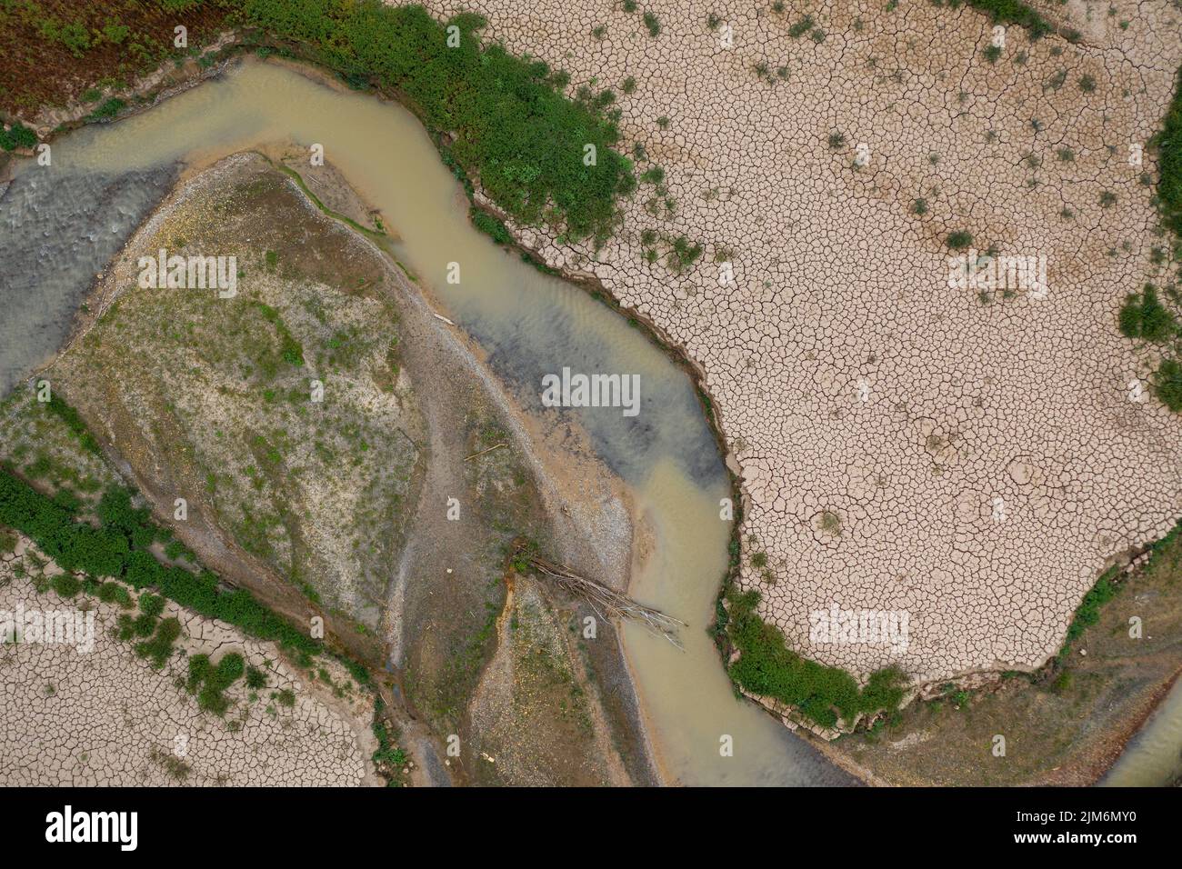 Aerial view of the area of Sant Salvador de la Vedella in the Baells reservoir completely dry during the drought of 2022 (Barcelona, Catalonia, Spain) Stock Photo