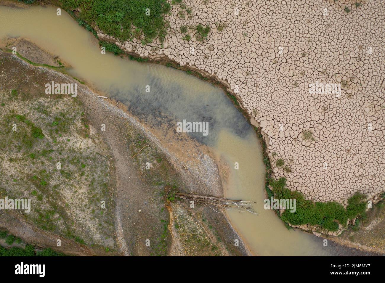 Aerial view of the area of Sant Salvador de la Vedella in the Baells reservoir completely dry during the drought of 2022 (Barcelona, Catalonia, Spain) Stock Photo