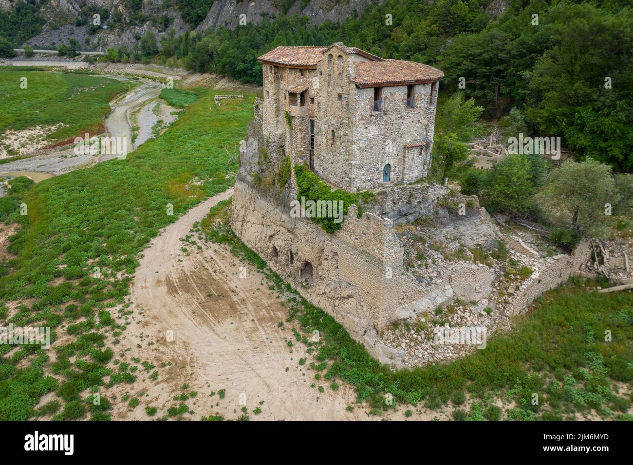 Aerial view of the area of Sant Salvador de la Vedella in the tail of the Baells reservoir completely dry during the drought of 2022 (Berguedà, Spain) Stock Photo