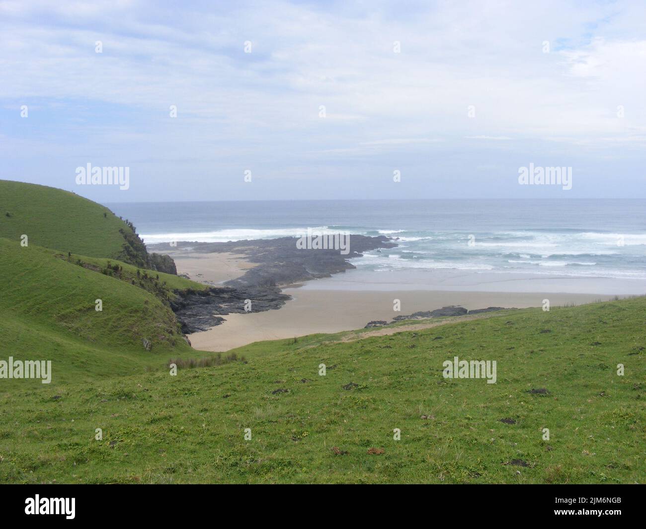 An aerial view of foam waves hitting a seashore Stock Photo - Alamy