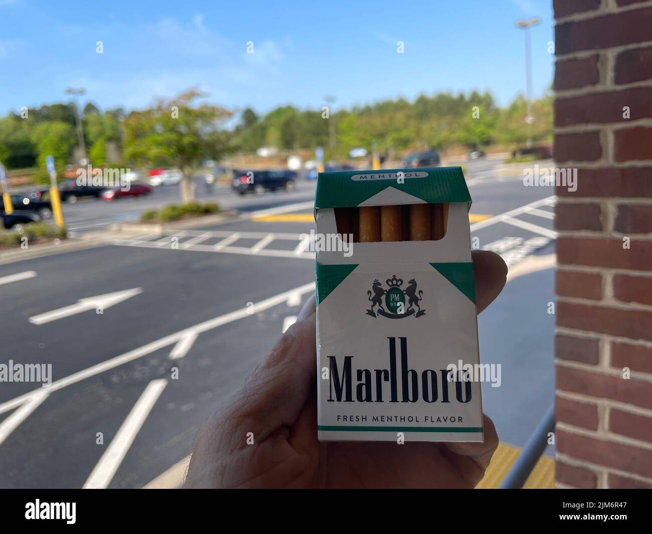 Augusta, Ga USA - 04 29 22: Hand holding Marlboro menthol Stock Photo