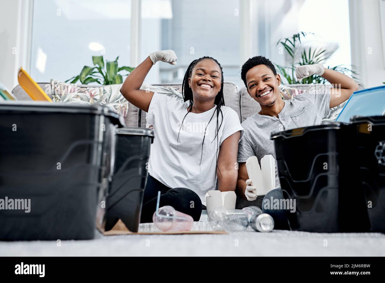 Less litter makes the world better. a young couple recycling their