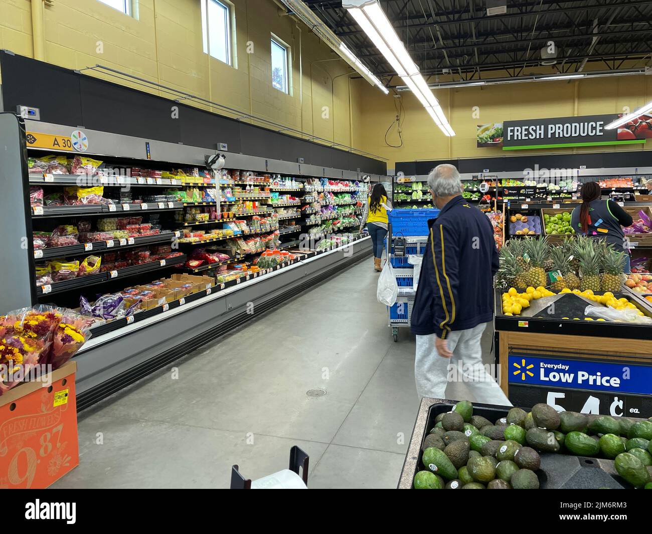 Augusta, Ga USA - 11 28 21: Walmart grocery store interior People in the produce area Stock Photo