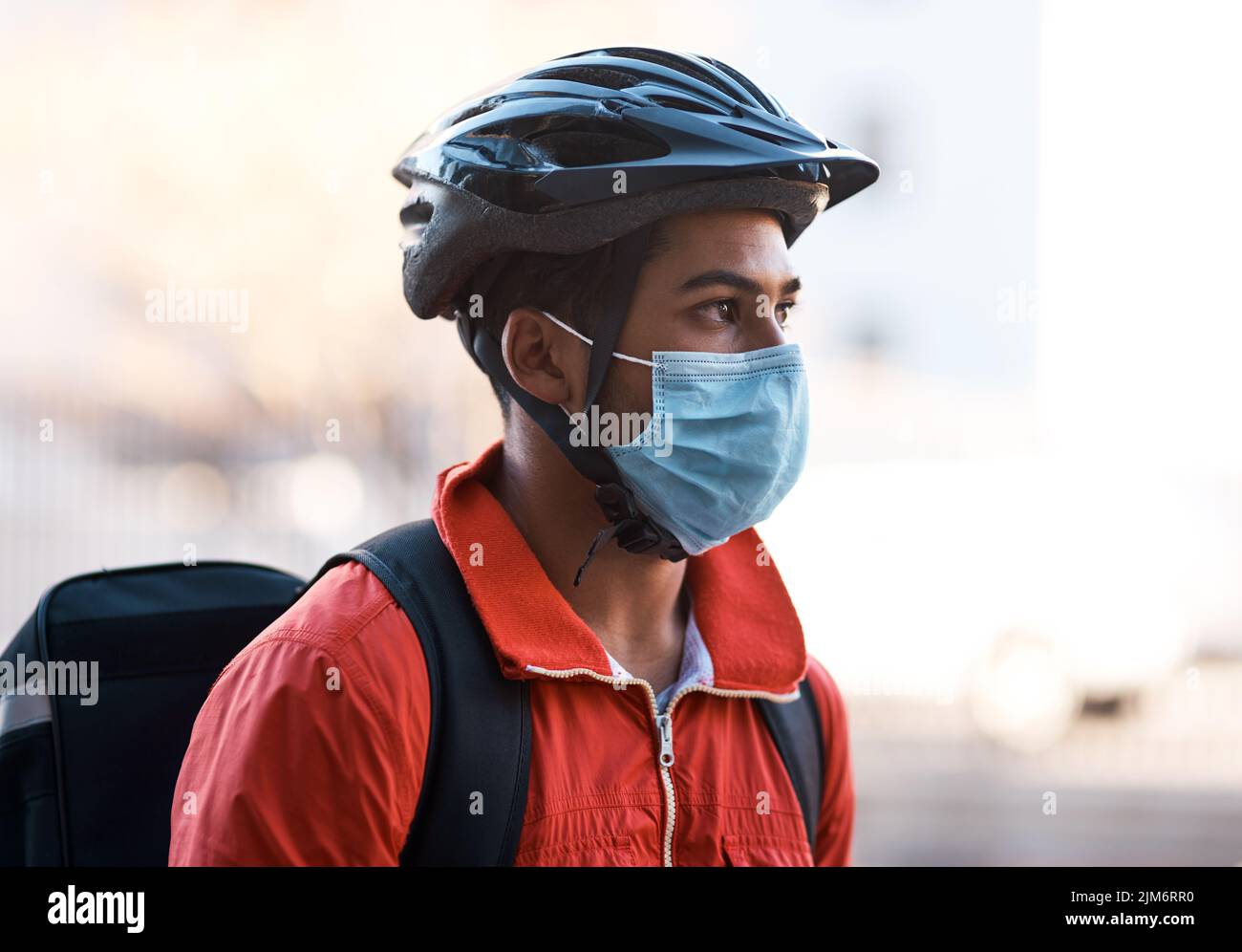 Deliver Rider Mask Delivery worker wearing helmet hi-res stock photography and images - Alamy