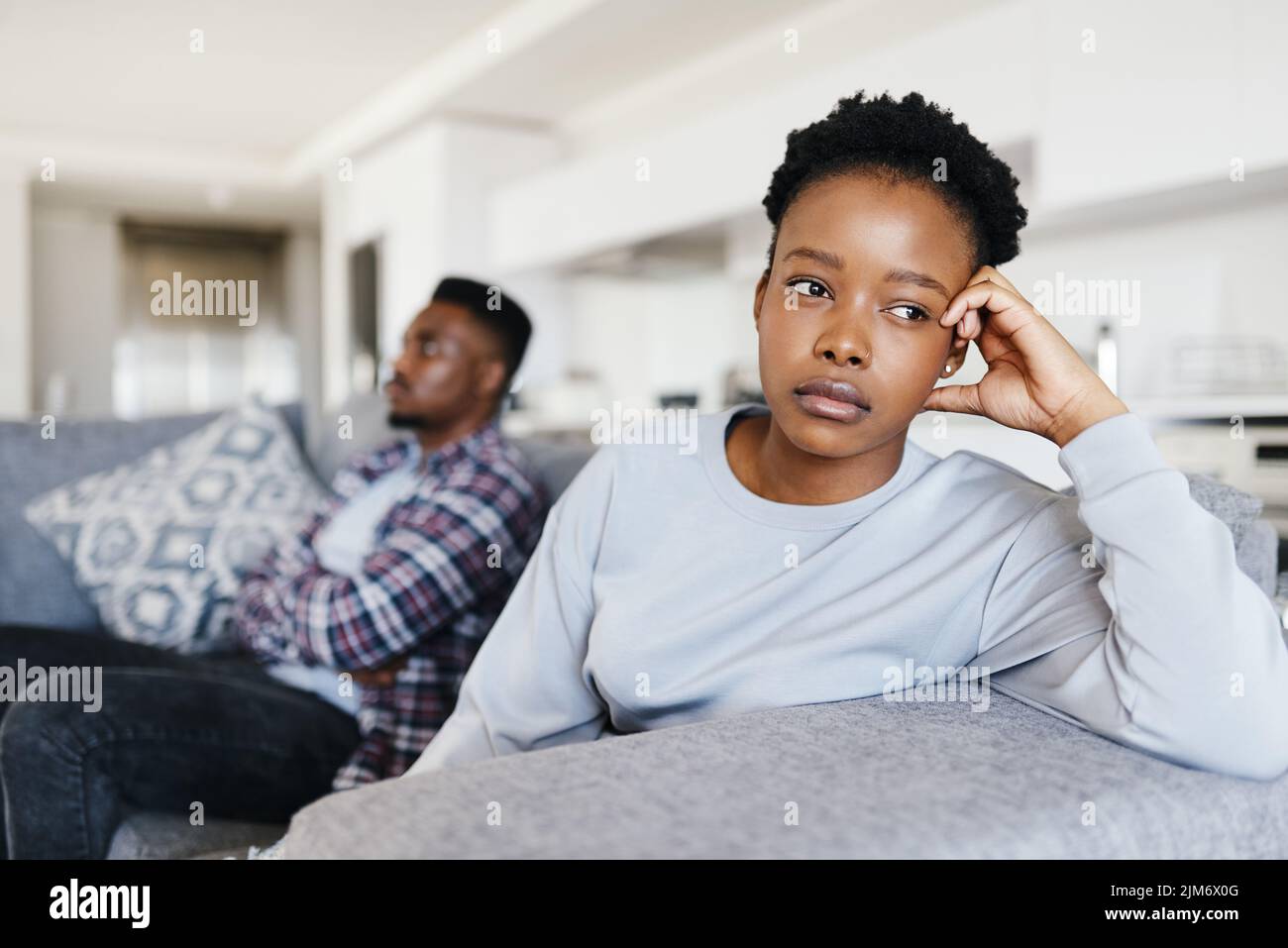 How did things get this bad. a young couple having a disagreement at home. Stock Photo