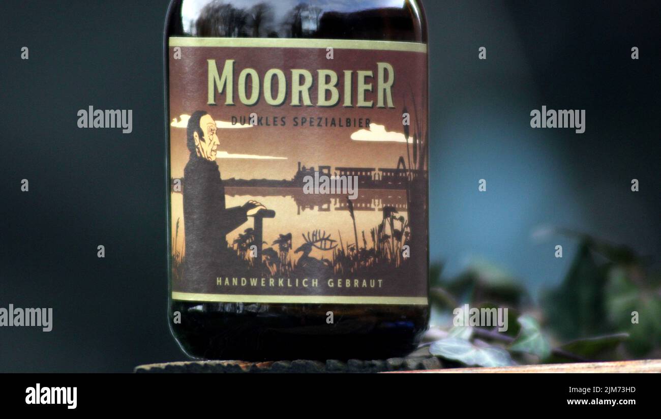 it is a popular regional beer in the area of osterholz scharmbeck and devils moorit is a dark beera close-up of the label Stock Photo