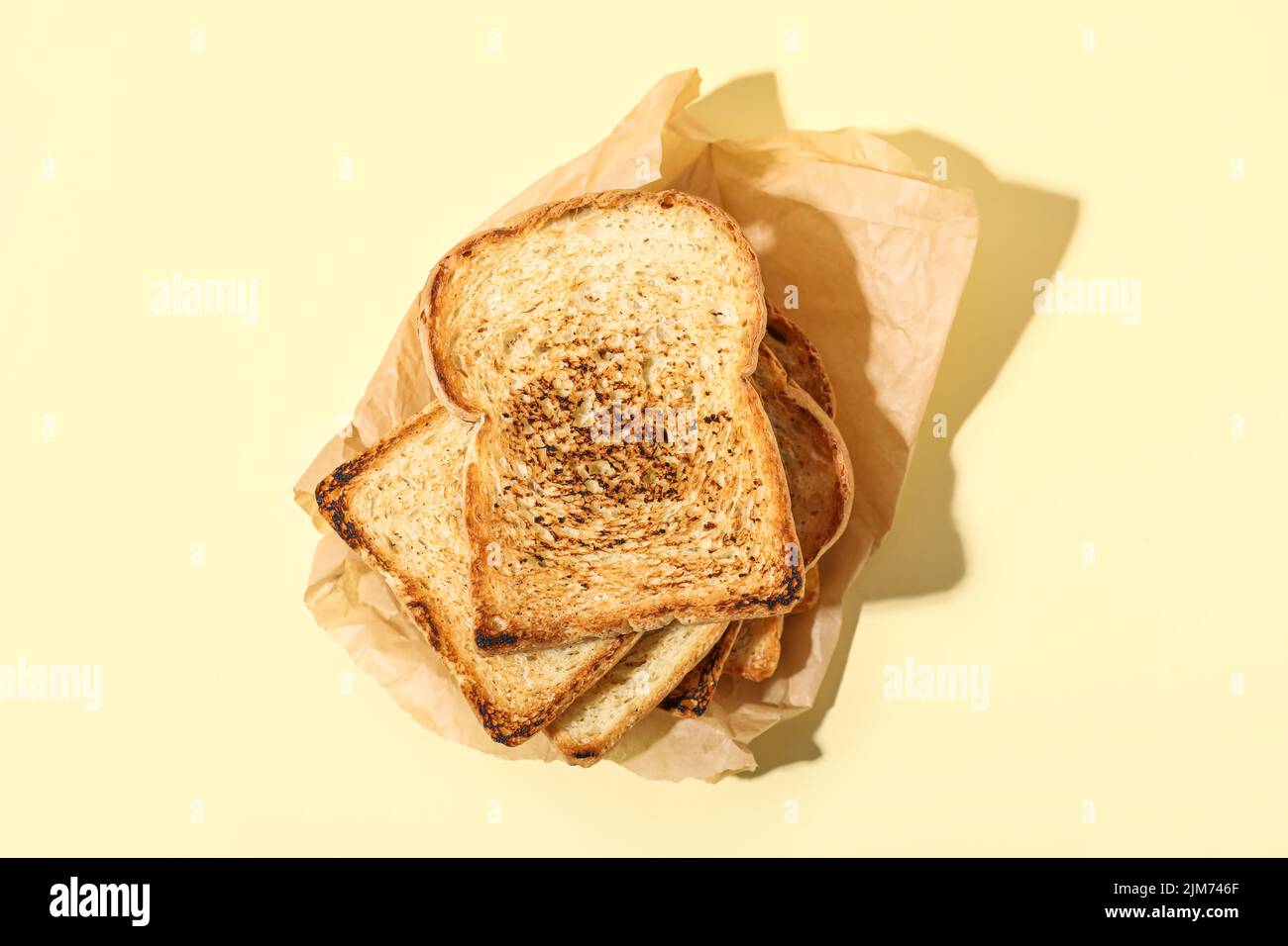 Stack of toasts on color background Stock Photo