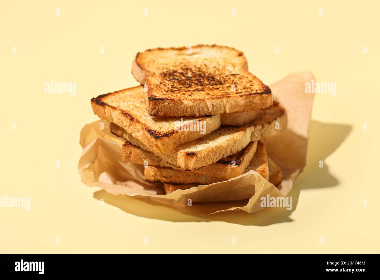 Stack of toasts on color background Stock Photo