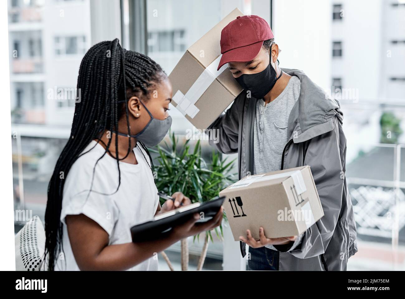 Cant shop in store Use a delivery service. a masked young woman signing ...
