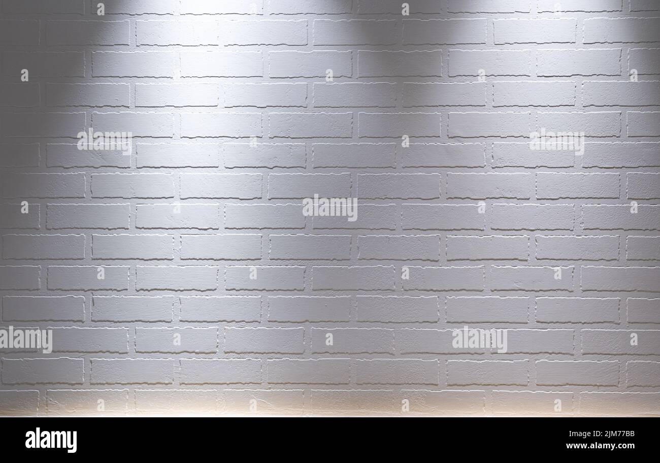 A white brick wall textured background with spotlight lighting Stock Photo