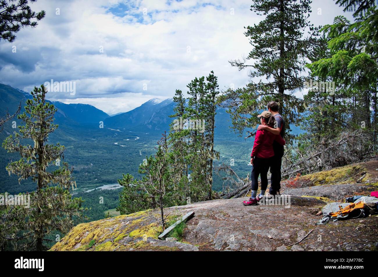 Mature couple standing on the top of the mountain Stock Photo - Alamy
