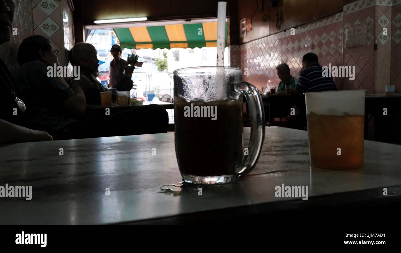 Ice Coffee with Ice Tea as a Chaser Coffee shop Chinatown Bangkok Thailand Stock Photo