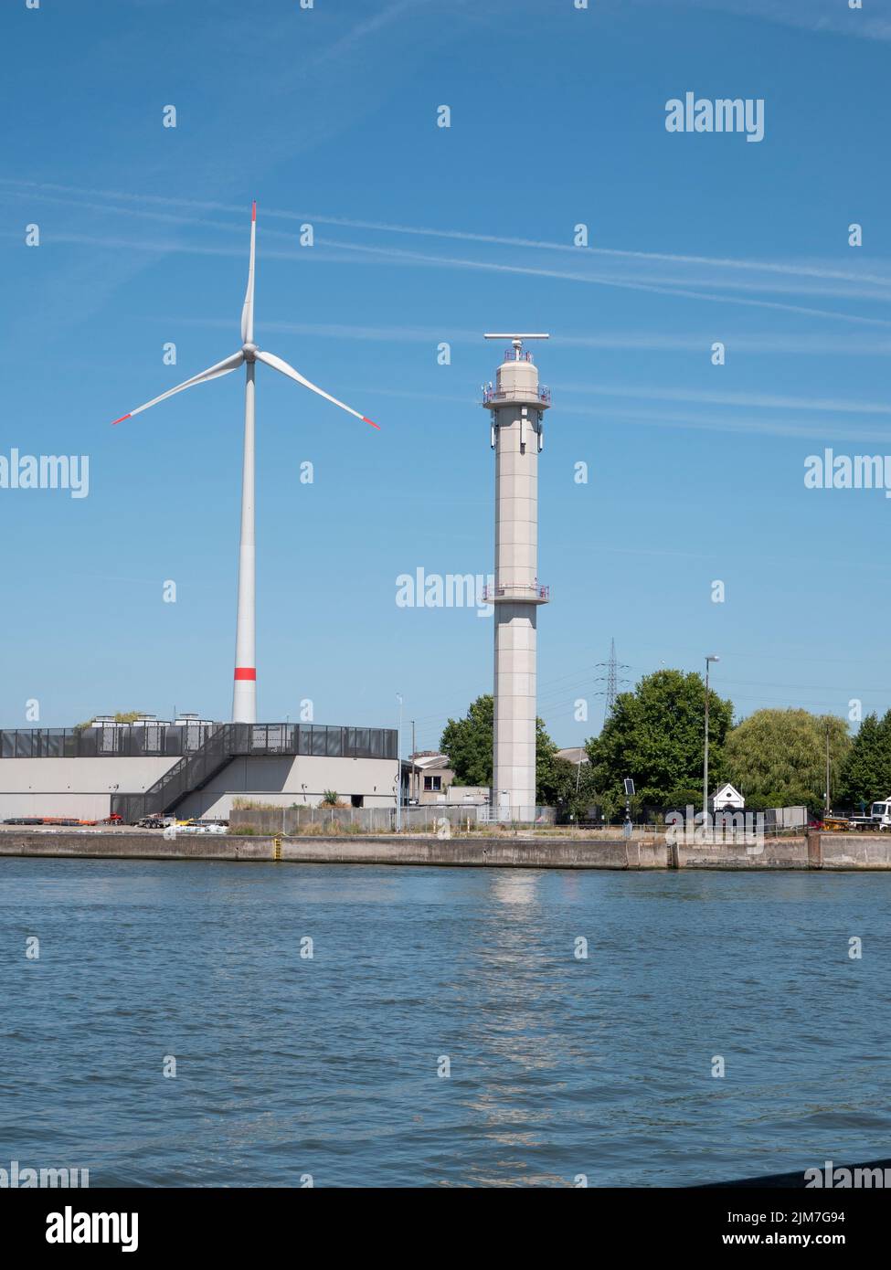Antwerp, Belgium, 24 July 2022, Radar tower and windmill at the port of
