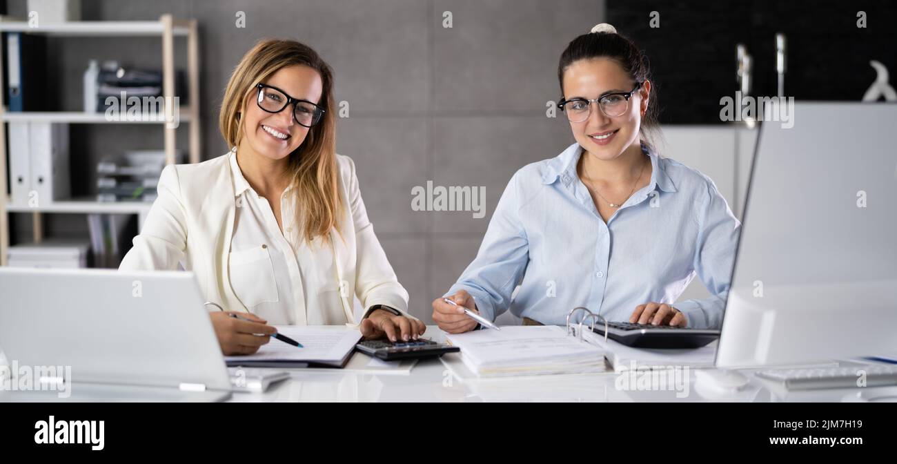 Business Accountant People Doing Tax Audit And Accounting Using Calculator Stock Photo