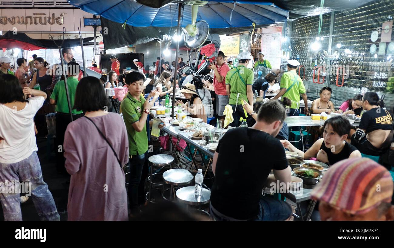 Tourist Eating Evening Meal on Soi Texas Chinatown Bangkok Thailand Stock Photo