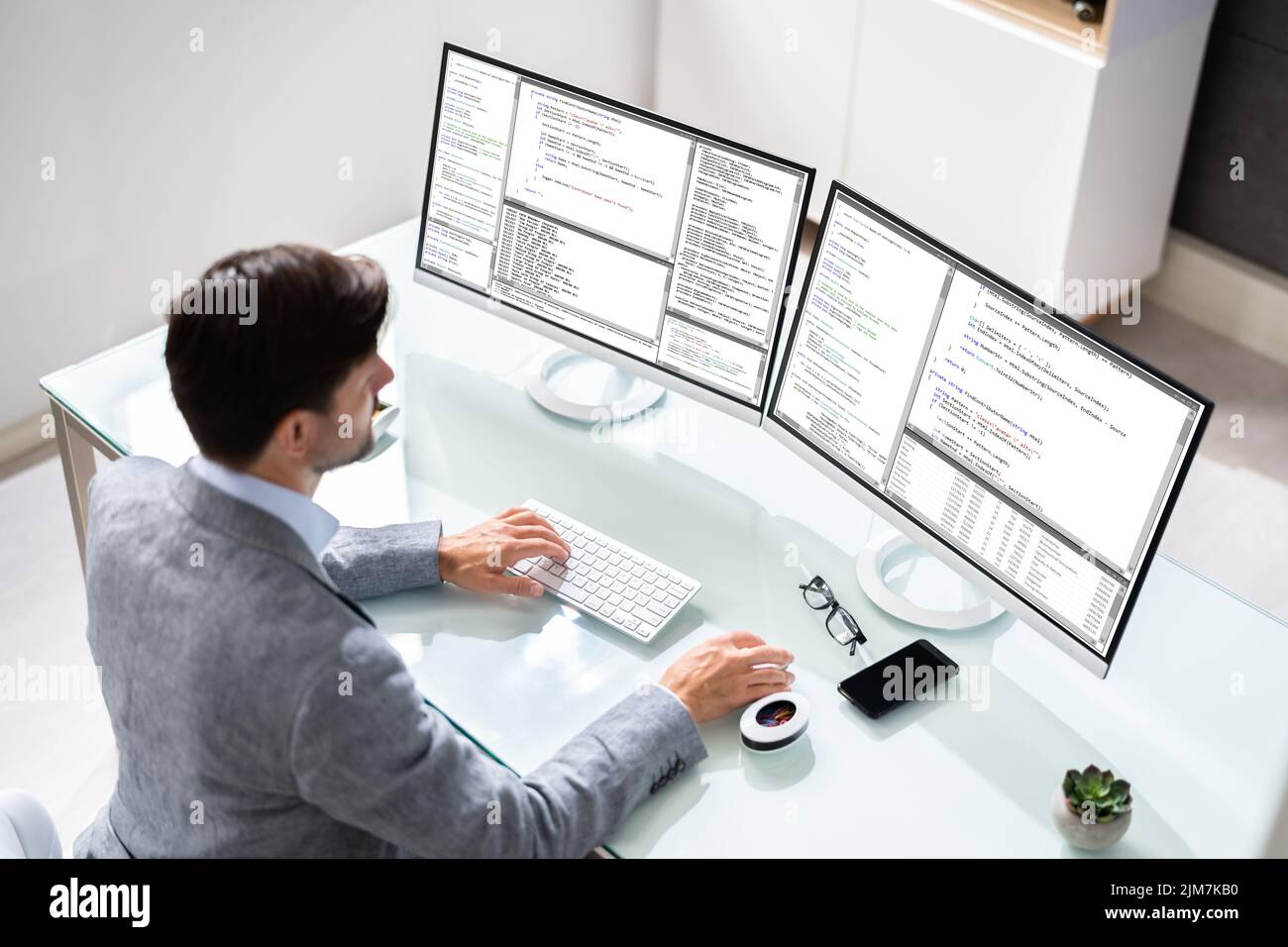Work From Home On Multiple Computer Screen Stock Photo