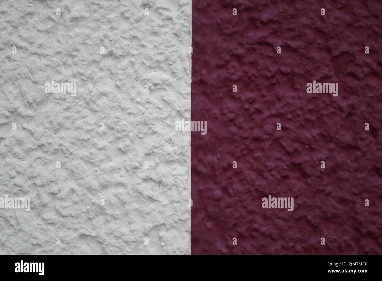 White (left) and red (right) painted plaster on house wall, use: texture, copy space, background, concept: maritime design (horizontal) Stock Photo